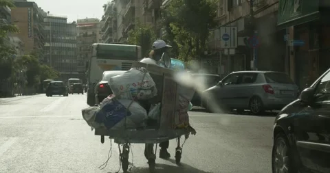 Homeless Man Moving Belongings On Pull Wagon Athens Greece Oct 13 2019 Stock-Footage 337804624