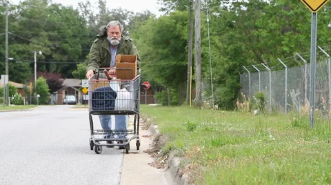 Homeless Man Pushing Cart Stock Footage