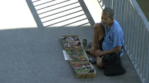 Homeless Man Selling Things On The Sidewalk 스톡 동영상 8991353