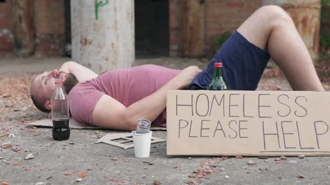 Homeless man with a sign please help dreams of his own house. Stock-Footage 306228044