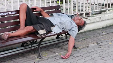 Homeless man sleep on bench 스톡 동영상 10603347