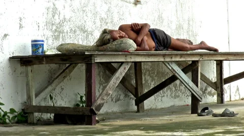 Homeless Man Sleeping On A Bench Stock-Footage 1089517