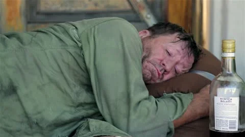 Homeless Man Sleeping Next to a Bottle - Model Released Stock Footage 11905812