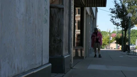 Homeless Man Walking Down Street 4K Stock Footage 137974635