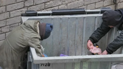 Homeless Men Looking Through Trash Stock Footage 121481495