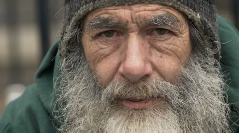 Homeless old man looking in the camera: poor man, beggar man, asking for charity Stock Footage 54617471