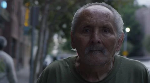 Homeless old man looking in the camera: poor man, beggar man, asking for charity Stock Footage 61951488