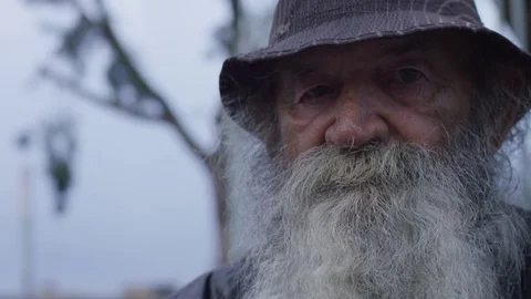Homeless old man looking in the camera: poor man, beggar man, asking for charity Stock Footage 82870830