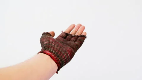 Homeless or poor human hand in fingerless glove making beckoning and begging Stock Footage 330846758
