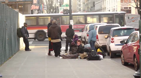 Homeless people loitering on streets downtown (youth men people woman) Stock Footage