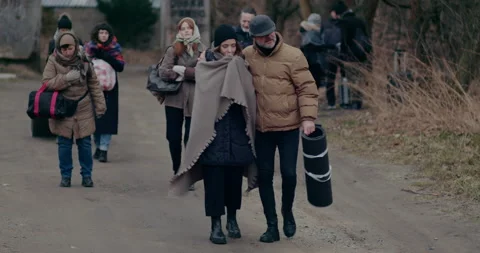 Homeless Refugees Walking On Road While Migrating During War. Stock Footage 179047358