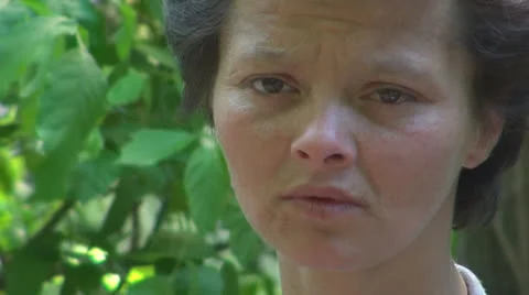 Homeless. Sad, homeless poor woman, disoriented.Sad eyes, tears. Stock Footage