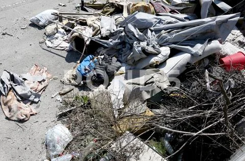 Homeless shelter with broke mattresses and tatters rags and garbage Stock Photos