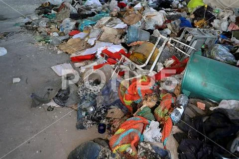 Homeless shelter with many blankets tatters and verty idrty material Stock Photos