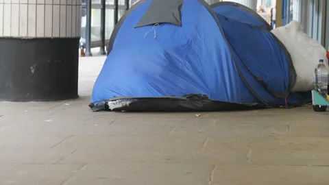 A homeless sleeping tent on a sidewalk. Video stock 126456908