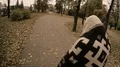 Homeless tramp wandering city streets, looking for food and lodging for night HD Footage