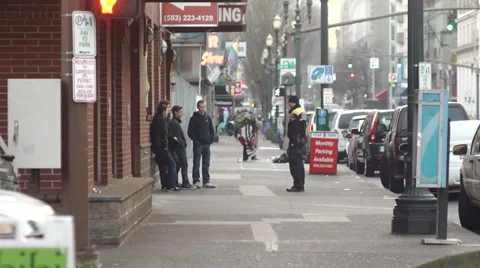 Homeless troubled youth talking to police downtown Stock Footage