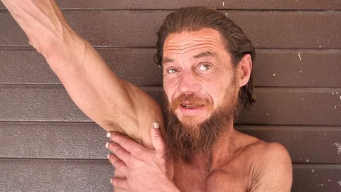 Homeless wanderer talks on the camera Video stock 119488644