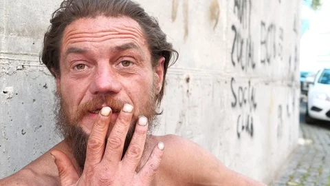 Homeless wanderer talks on camera Video stock 119488957