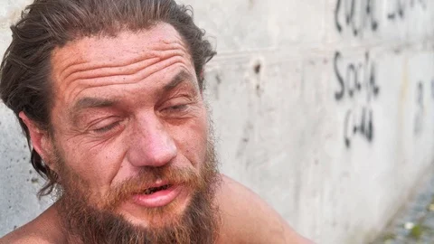 Homeless wanderer talks on the camera Stock Footage 120133889