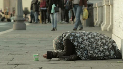 Homeless woman have an alms Stock Footage