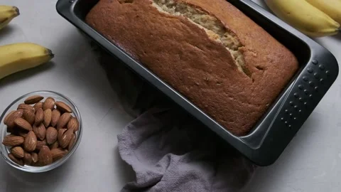 Homemade banana bread in the baking sheet. Top view Stock Footage 160579233