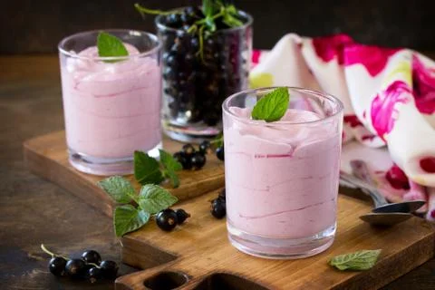 Homemade  black currant mousse on rustic wooden table. Fotos Stock
