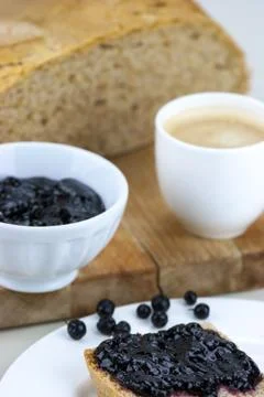 Homemade blueberry jam with integral bread and coffe Stock Photos
