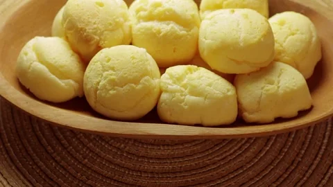 Homemade Brazilian Cheese Bread Stack Rotating In Wooden Bowl Stock Footage 337273293