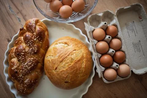 Homemade bread and eggs on rustic kitchen table Foto stock