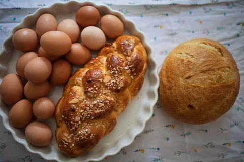 Homemade bread and eggs on rustic kitchen table Foto stock