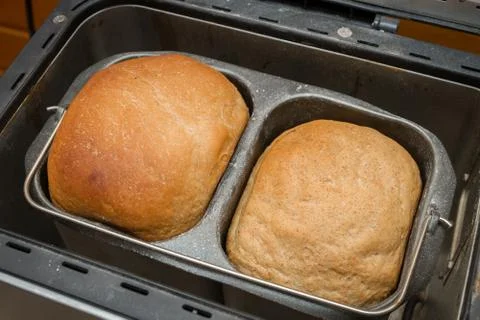Homemade bread is baked in a bread maker Stock Photos