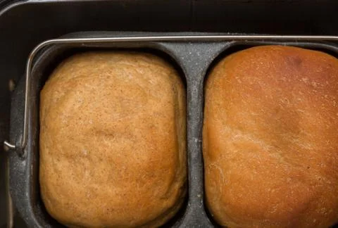Homemade bread is baked in a bread maker Stock Photos