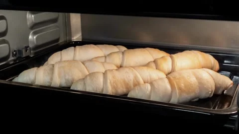 Homemade bread baking in oven. Bread is raised and baked. Organic fresh bread. Stock-Footage 336576848