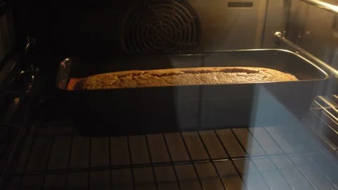 Homemade bread baking in an oven Stock Footage 292402962