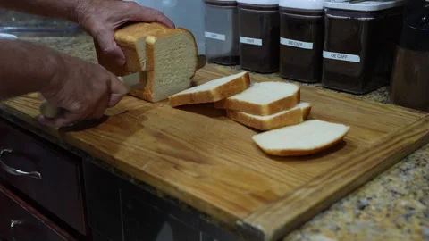 Homemade Bread Being Sliced in a Kitchen Stock Footage 336310304