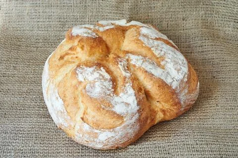 Homemade bread on a burlap Stock Photos