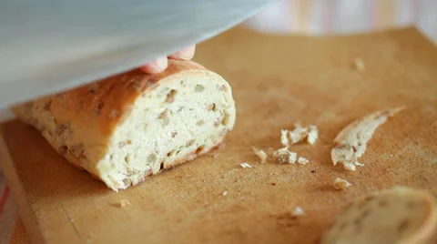 Homemade Bread cut onto thin slices using sharp knife Stock Footage 35976437