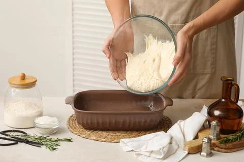 Homemade bread dough preparation for baking, hands transferring freshly mixed Stock Photos