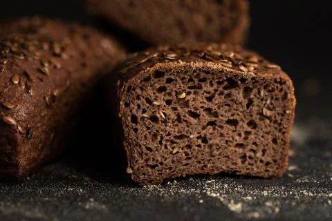 Homemade bread loaf on rustic dark background Stock Photos
