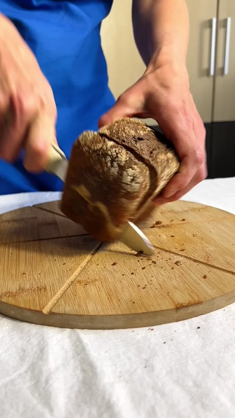 Homemade bread loaf without yeast or gluten in woman hands. Image for health Stock Footage 314896986