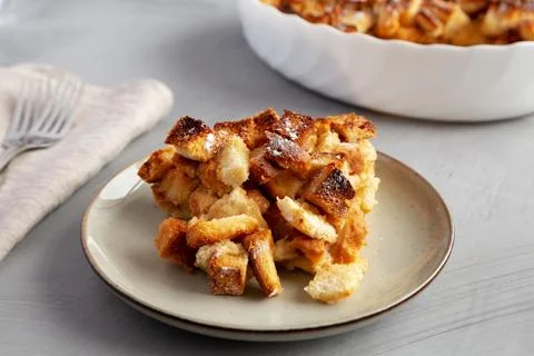 Homemade Bread Pudding on a Plate, side view. Close-up. Stock Photos