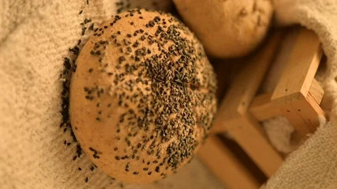 Homemade bread on a rustic background. Vertical video of fresh bread. Stock Footage 137358294