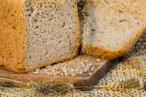 Homemade bread on a rustic scene with wheat Stock Photos