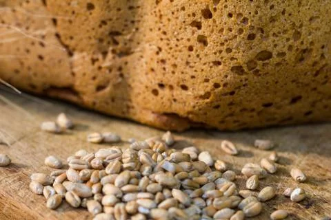 Homemade bread on a rustic scene with wheat Stock Photos