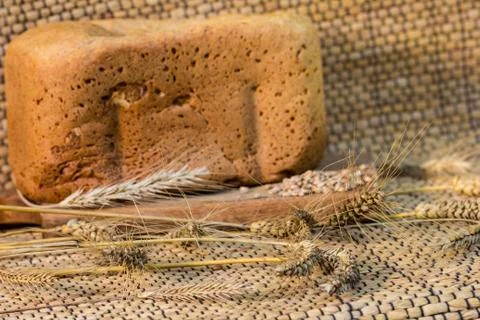 Homemade bread on a rustic scene with wheat Stock-Fotos