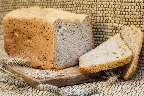 Homemade bread on a rustic scene with wheat Stock-Fotos