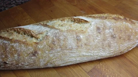 Homemade bread on wooden table Stock Footage 148411361