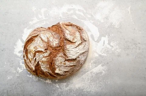 Homemade brown bread on a table, top view. Stock Photos