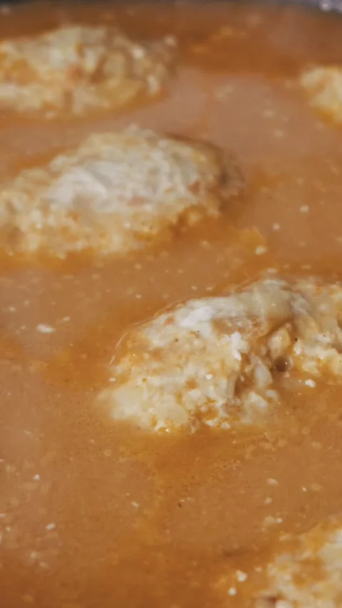 Homemade Cabbage Rolls Simmering In Tomato Sauce Stock Footage 327857344